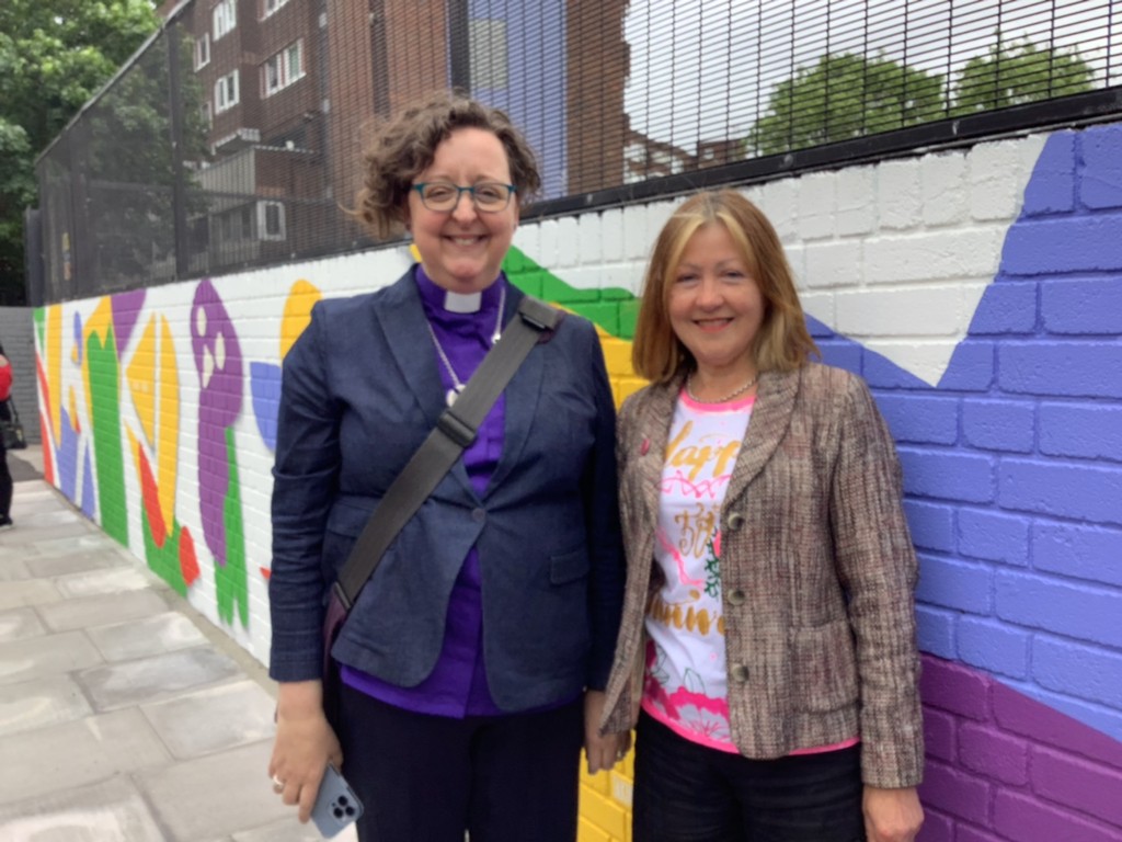 Rt Revd Dr Joanne Grenfell of Stepney and Ms Horton (Co-Headteacher) by the new mural commissioned for the event.